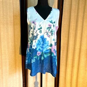 Size small shirt. New without tags. Flowered front and back. Very nice. Comfy.